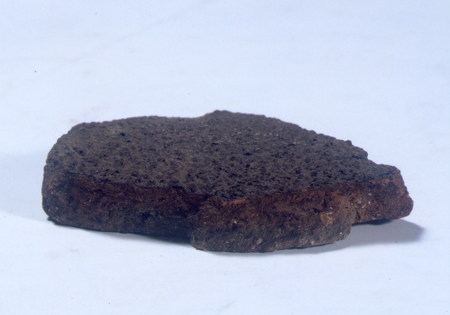 A piece of roof tile as a replacement of remains