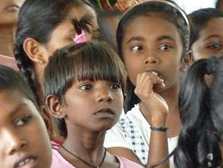 Children staring at the puppet show