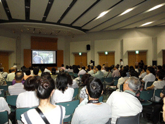 Forum participants listen to a description of the film 'The Back of Destiny'