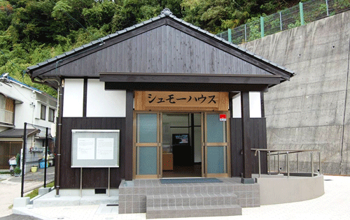 Schmoe House, relocated and opened as an exhibition facility