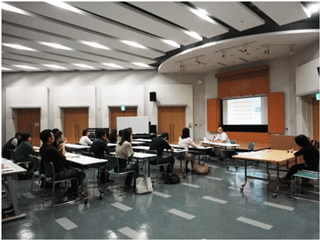 Participants listening intently during the course