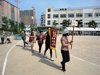 International students proceeding into the venue