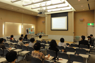 Participants listening intently to Associate Professor Jacobs at the General Public seminar