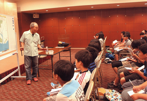 Children listening attentively to the testimony