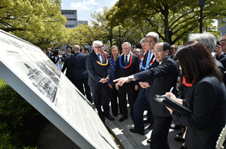 Mayor Matsui provides an explanation in front of Atomic Bomb Dome