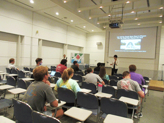 The group listens to an atomic bomb testimony