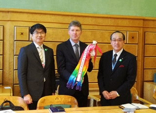 Mr. Bugajski, chairperson of the Preparatory Committee, receiving a thousand paper cranes