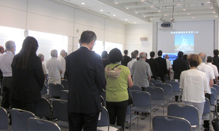 Participants observing a moment of silent prayer