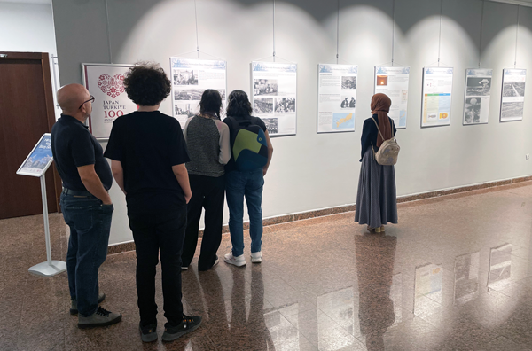 Visitors read with interest the explanations on A-bomb photo panels